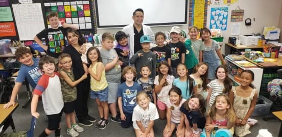 Dr. Francisco Suarez teaching a local classroom about oral health