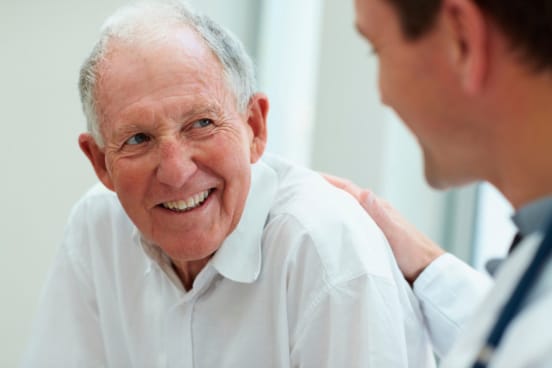 Surgeon answering a patient