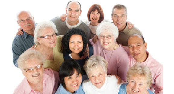 Group of smiling senior people that are all candidates for an implant-supported denture